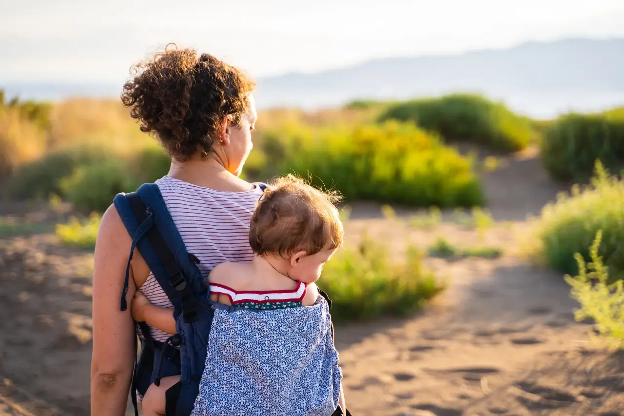 back-of-a-mother-walking-with-baby- best-baby-carrier