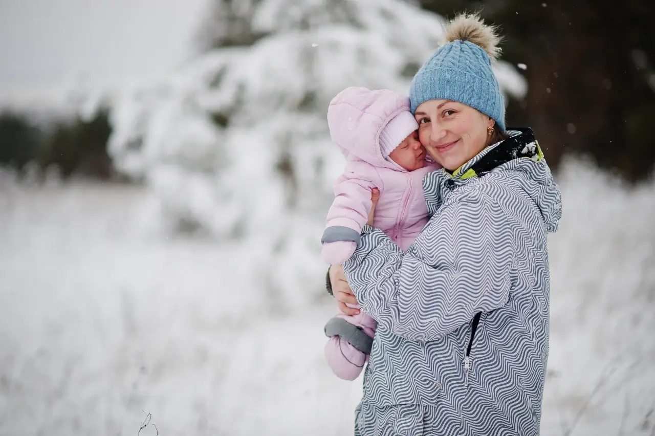 mother-with-baby-girl-todler-at-winter-day. winter clothes for infants