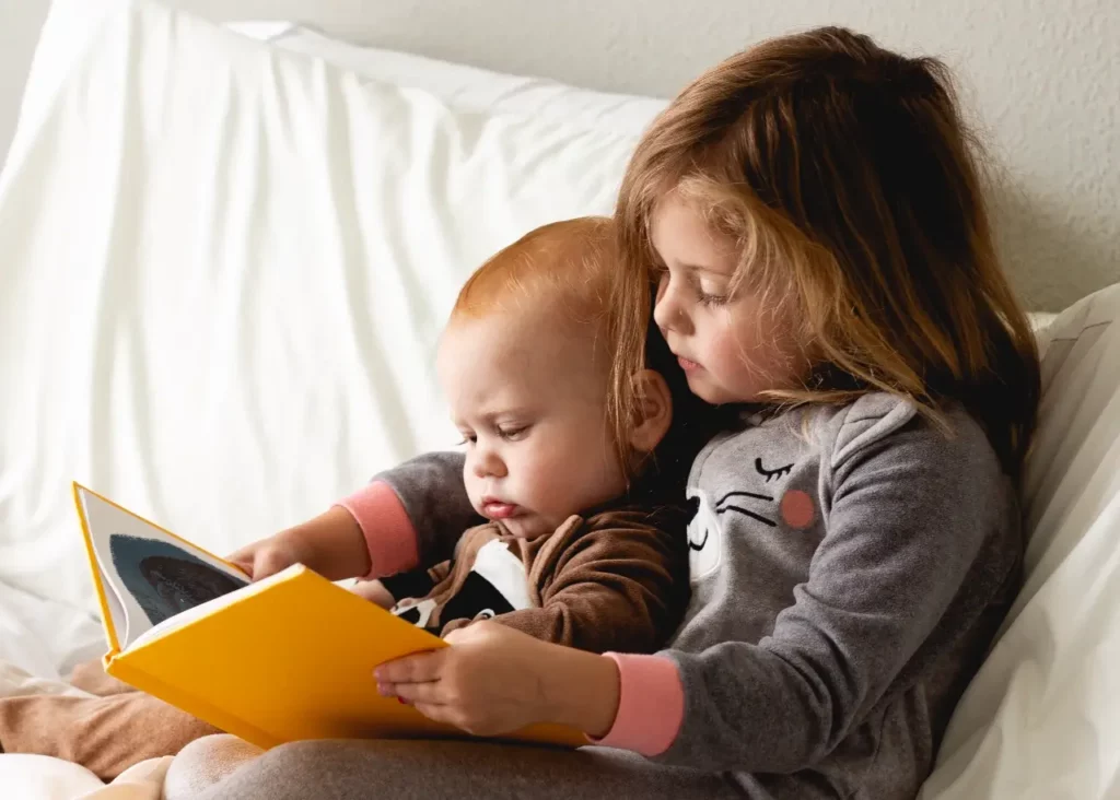 sister-reading-to-brother