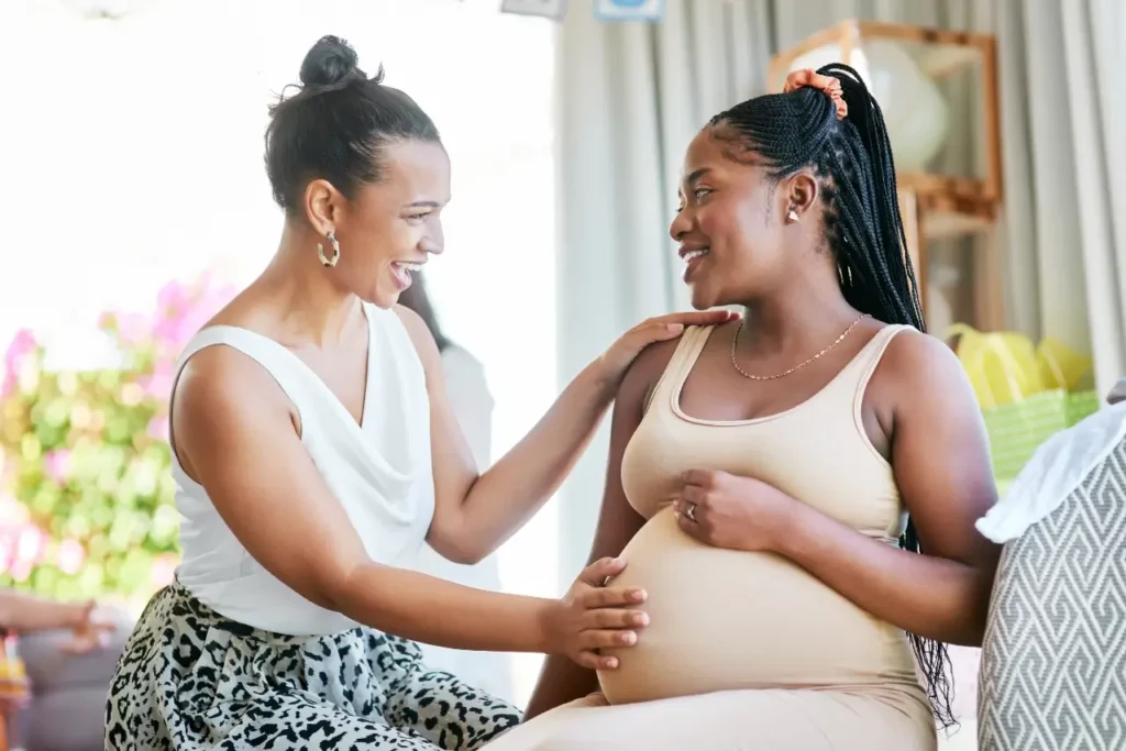 photo-of-a-doula-touching-belly-of-pregnant-woman. Types of doulas