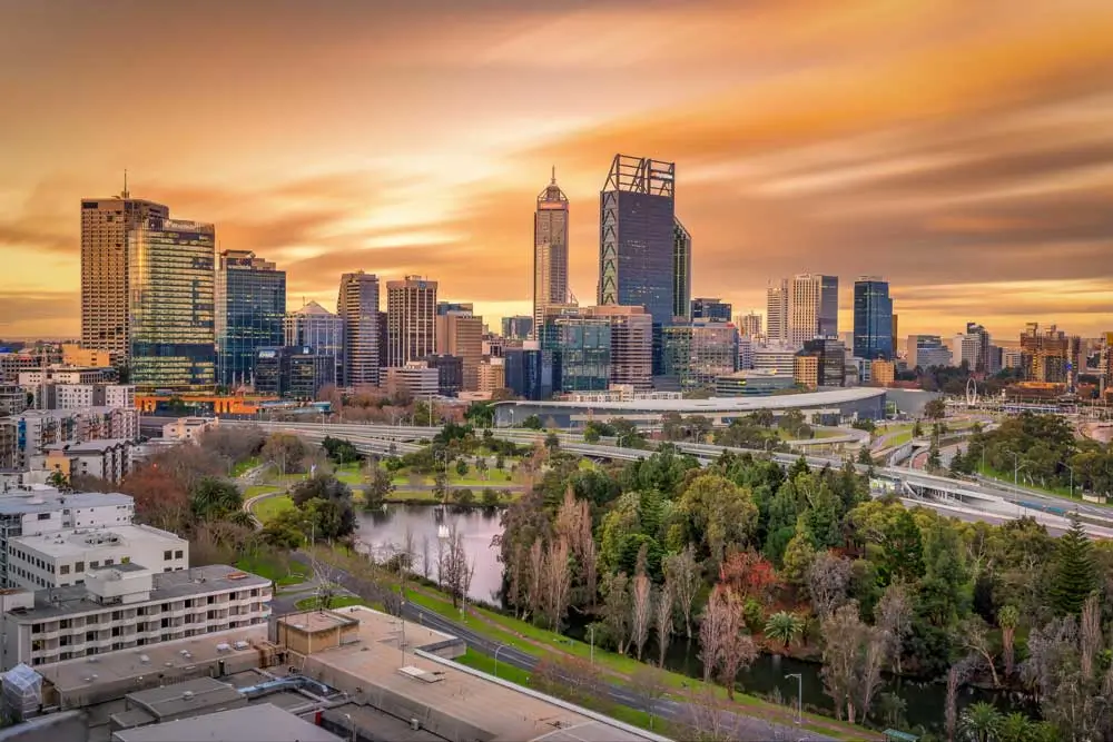 A beautiful sunset over the Perth skyline, highlighting the vibrant city where doula perth services are available to support families.